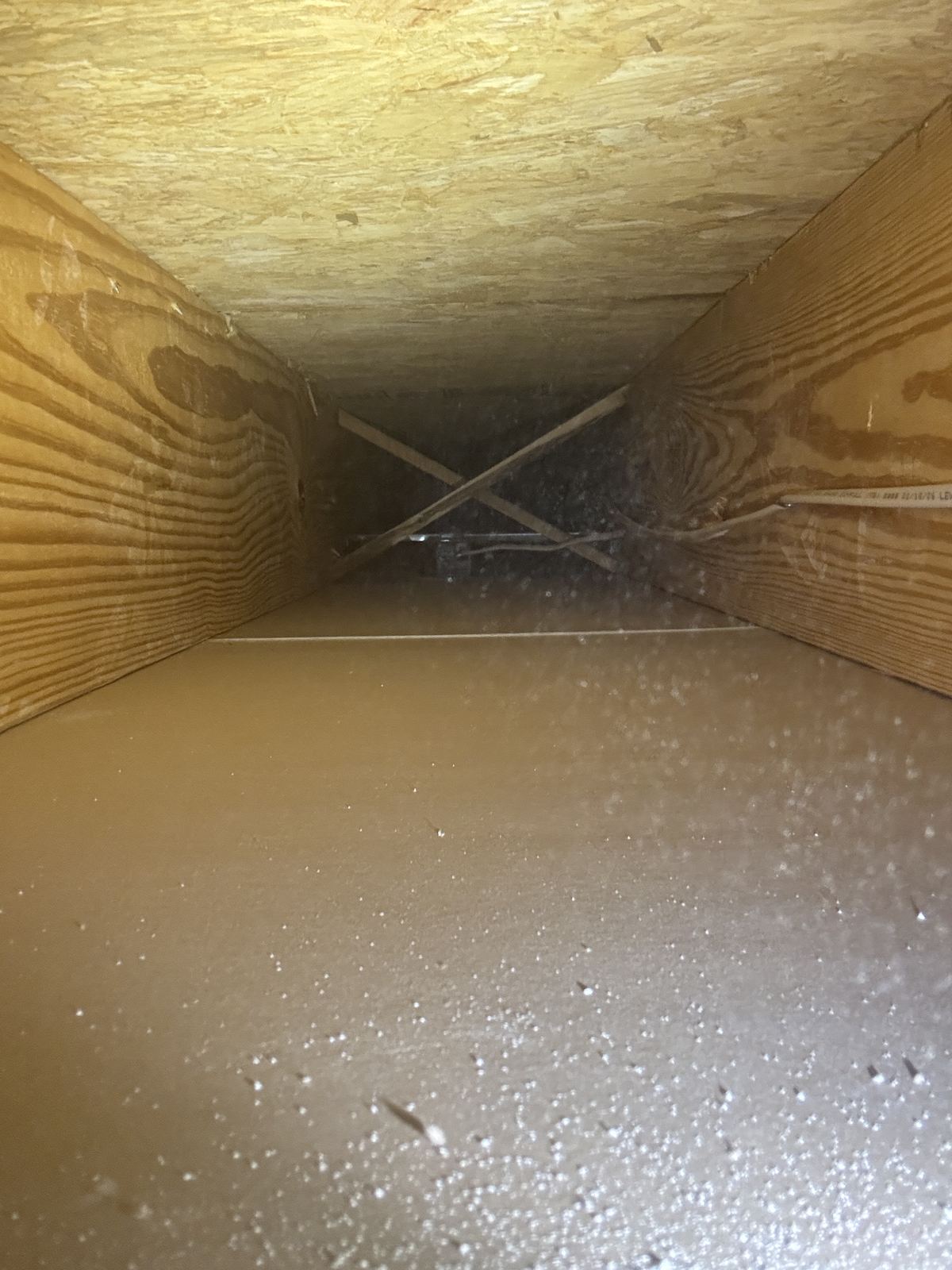 Attic view of the exhaust duct run for a range hood vent