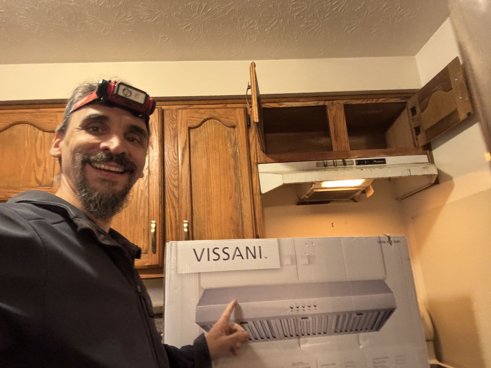 Gabriel with the new under-cabinet range hood ready to install