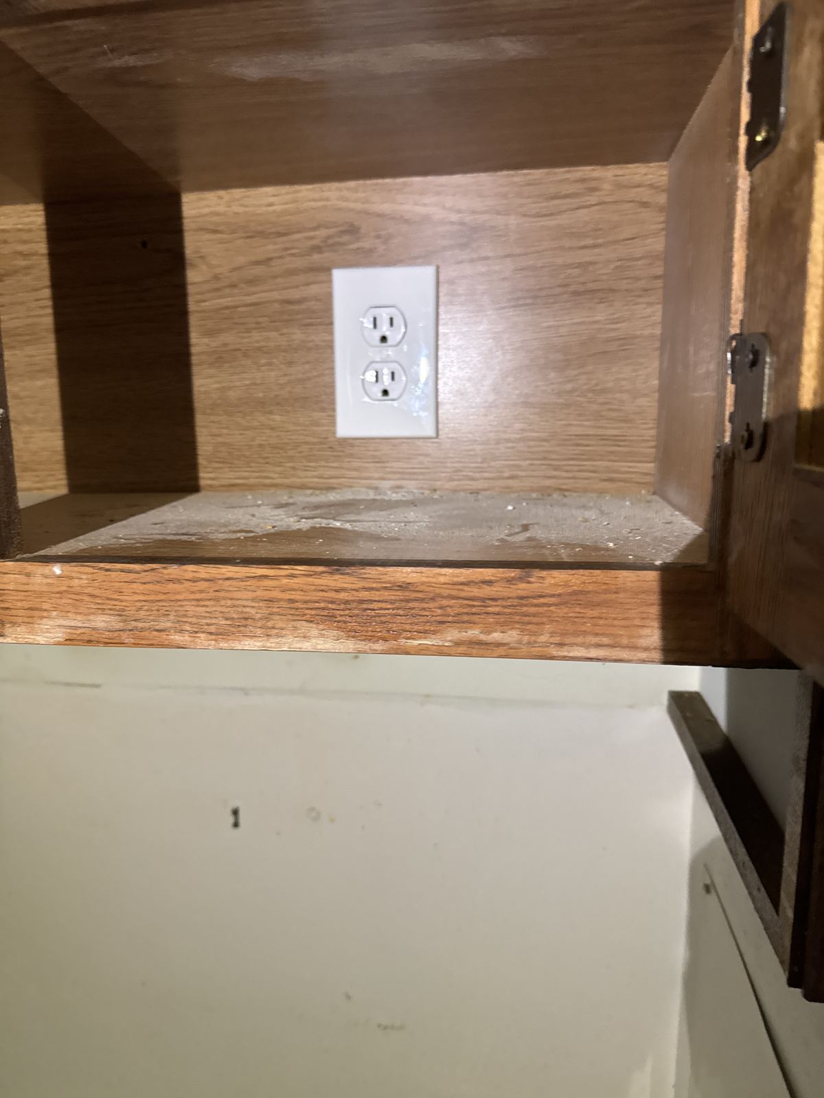 Finished outlet inside the cabinet to power the range hood