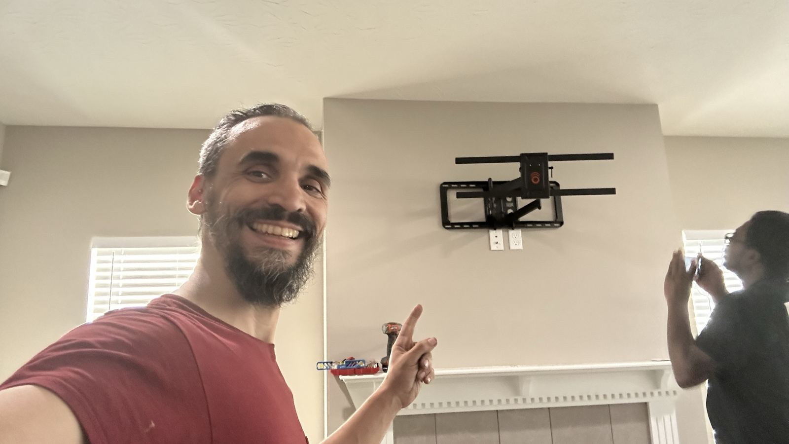 Full-motion TV wall mount installed and ready for the TV