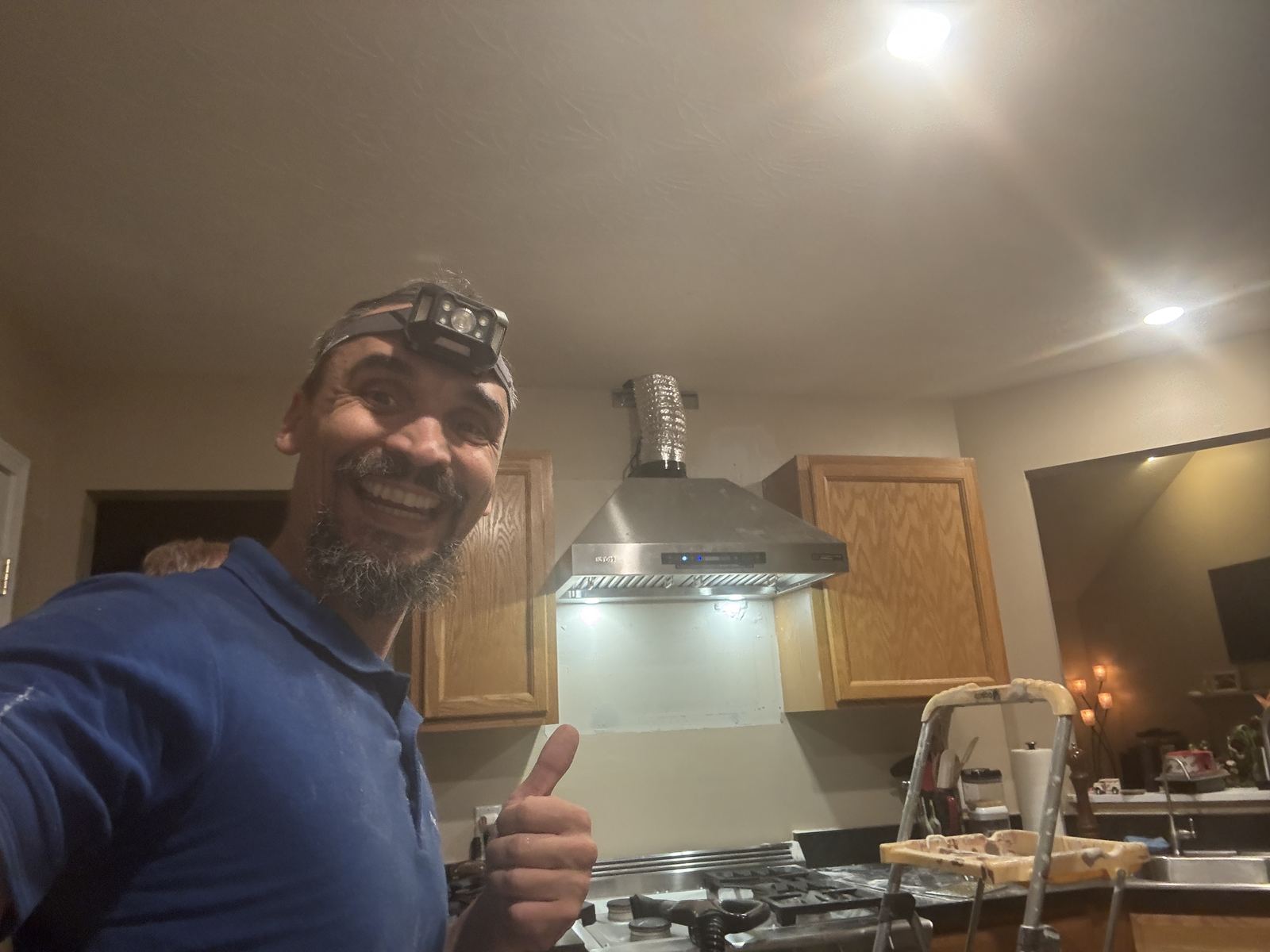 Handyman Gabriel with a newly installed chimney range hood