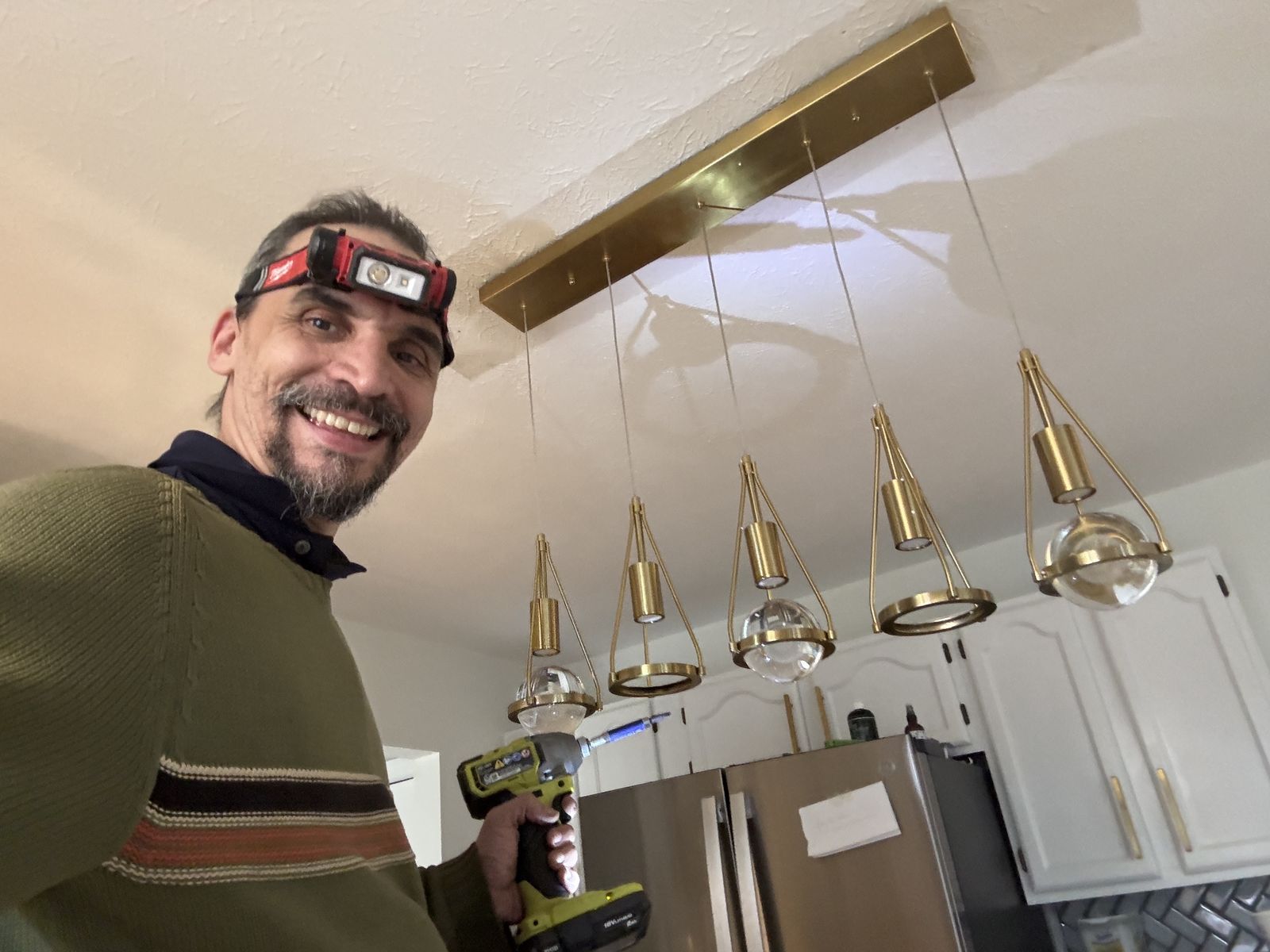 Gabriel with newly installed kitchen island pendant lights