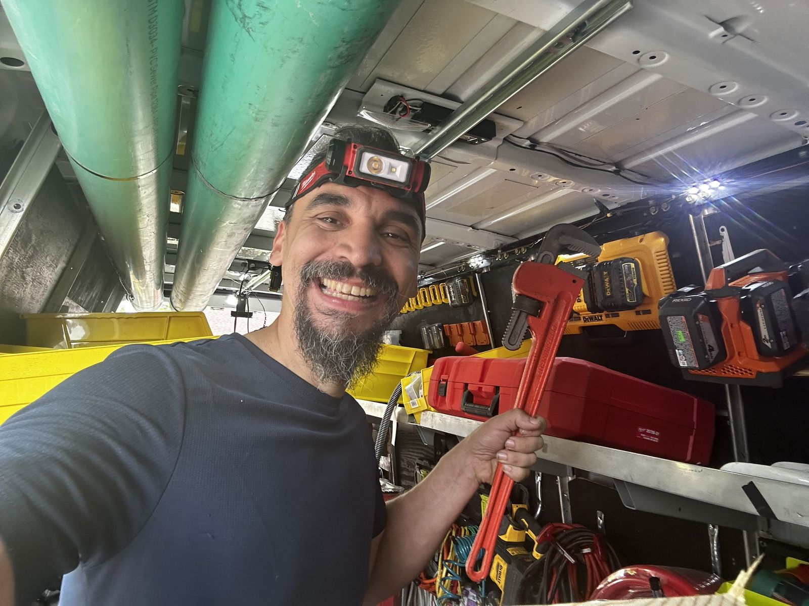 Pipe wrench in hand, ready for a plumbing call