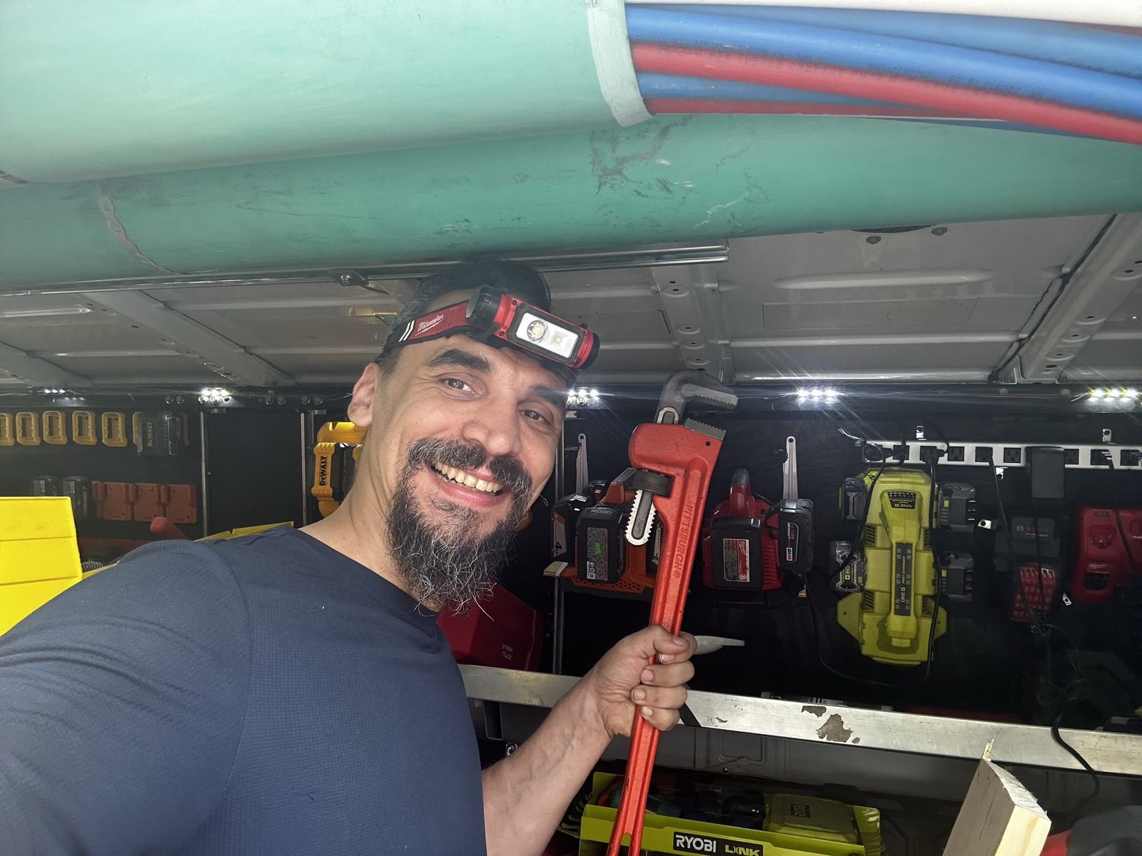Pipe wrench and PEX supply lines in the work van